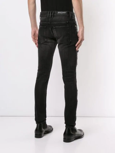 Shop Balmain Slim-fit Destroyed Jeans - Black