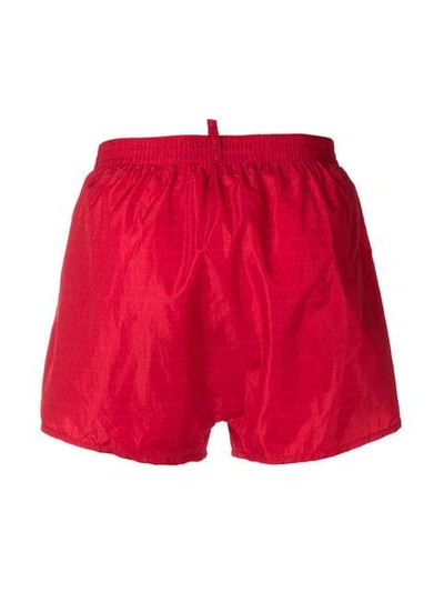 Shop Dsquared2 All Over Logo Swim Shorts In Red