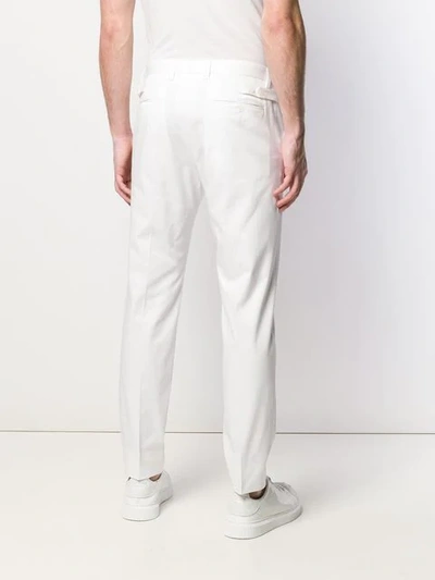 Shop Dolce & Gabbana Chino Trousers In White