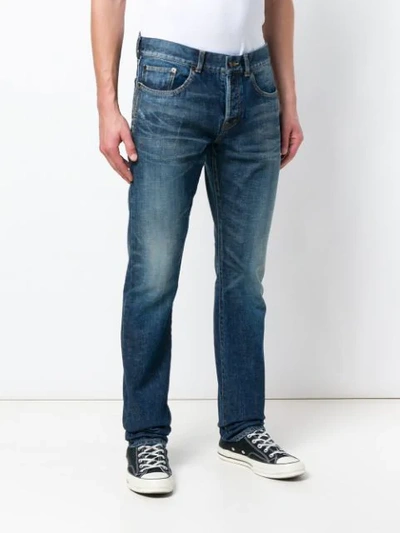 Shop Saint Laurent Distressed Mid-rise Straight Jeans In Blue