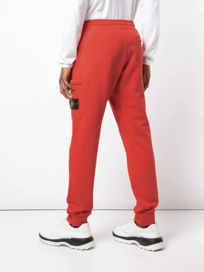 Shop Stone Island Coral Sweatpants In Red