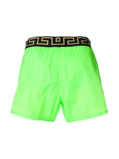 Shop Versace Logo Waist Swim Shorts In Green
