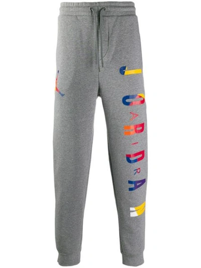 Shop Nike Jordan Dna Track Pants In Grey