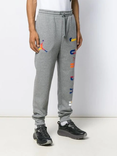 Shop Nike Jordan Dna Track Pants In Grey