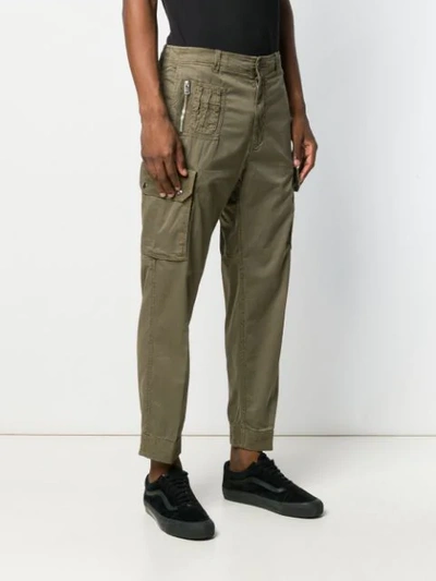 Shop Diesel Overdyed Cargo Trousers In Green
