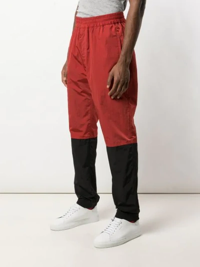 Shop Givenchy Two Tone Track Pants In Red