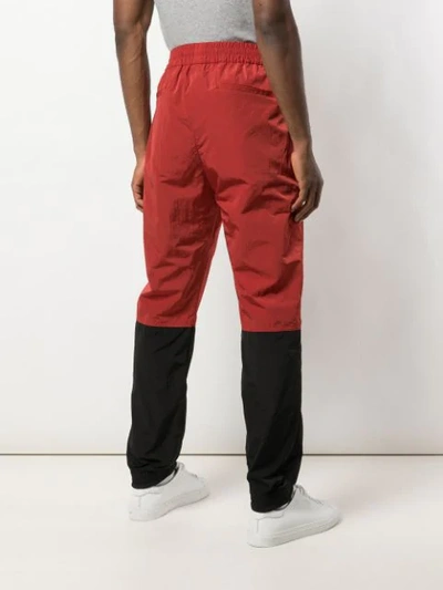 Shop Givenchy Two Tone Track Pants In Red