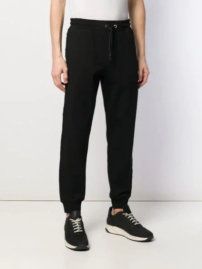 Shop Mcq By Alexander Mcqueen Logo Embroidered Track Pants In Black