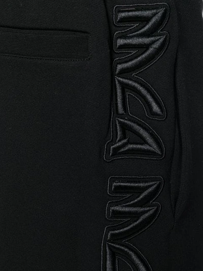 Shop Mcq By Alexander Mcqueen Logo Embroidered Track Pants In Black