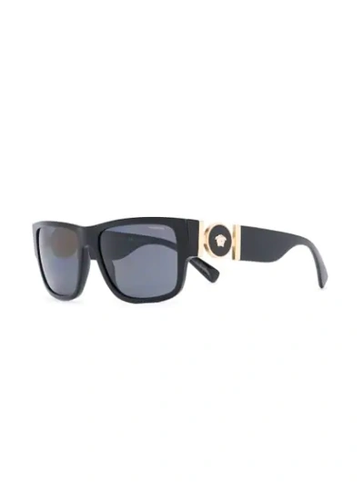 Shop Versace Logo Embellished Sunglasses In Black