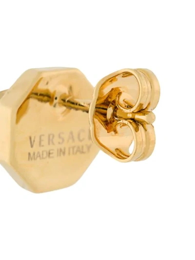 Shop Versace Logo Emellished Studs In Metallic