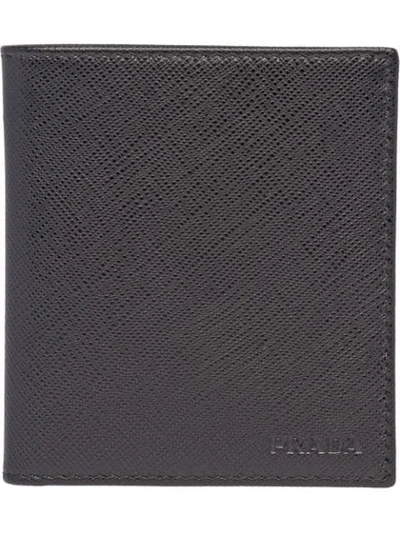 Shop Prada Foldover Saffiano Wallet In Black