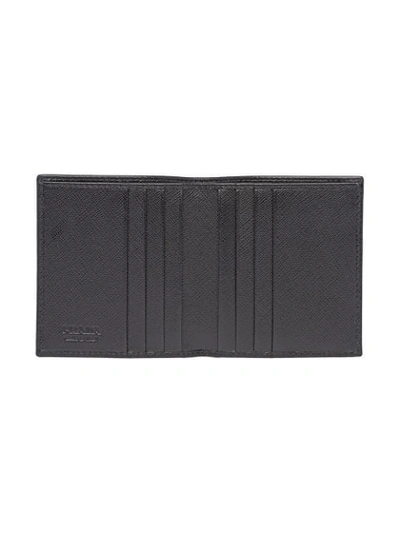 Shop Prada Foldover Saffiano Wallet In Black