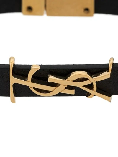 Shop Saint Laurent Opyum Monogram Bracelet In Black