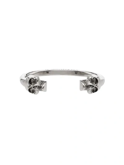 Shop Alexander Mcqueen Twin Skull Bangle-style Bracelet In Silver
