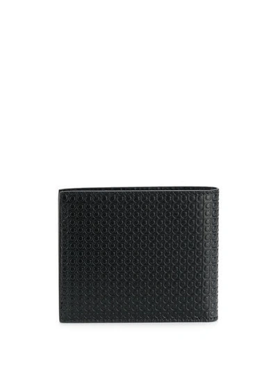Shop Ferragamo Logo Embossed Bi-fold Wallet In Black