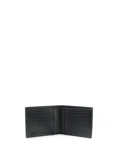 Shop Ferragamo Logo Embossed Bi-fold Wallet In Black