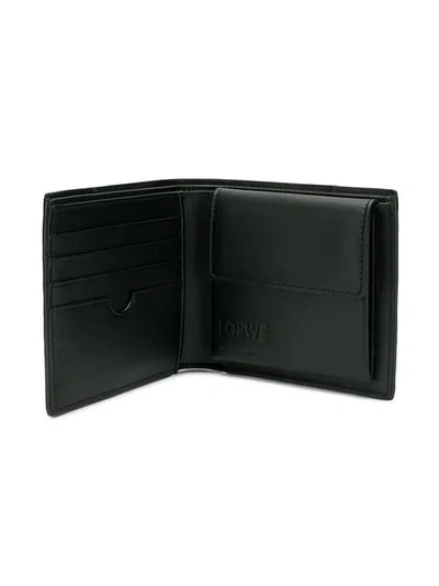 Shop Loewe Foldover Brand Embossed Wallet In Black