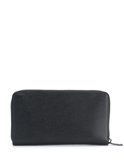 Shop Saint Laurent Monogram Zip-around Wallet In Black