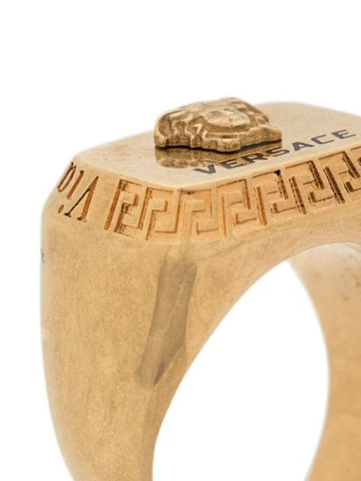 Shop Versace Engraved Logo Rectangle Ring In Gold