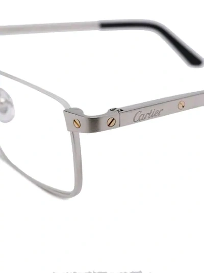 Shop Cartier Rectangular Frame Glasses In Silver