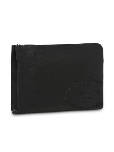 Shop Prada Saffiano Embossed Logo Clutch Bag In Black