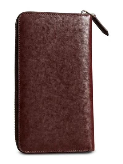 Shop Burberry London Leather Ziparound Wallet In Red