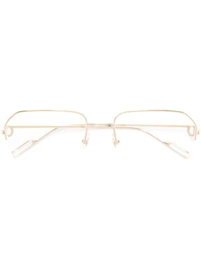 Shop Cartier Metallic Frame Glasses In Gold