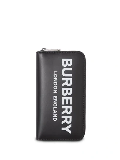Shop Burberry Logo Print Leather Ziparound Wallet In Black