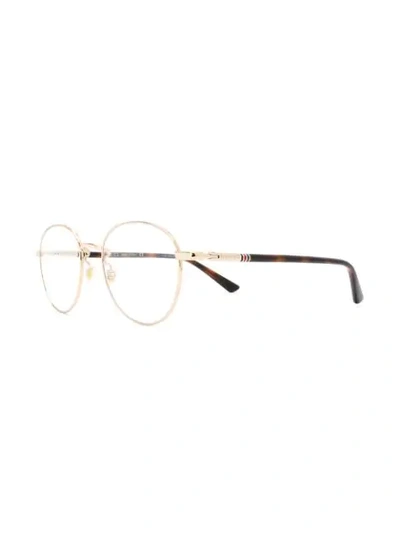 Shop Gucci Oval Frame Glasses In Metallic