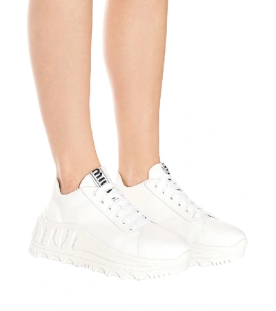 Shop Miu Miu Leather Flatform Sneakers In White