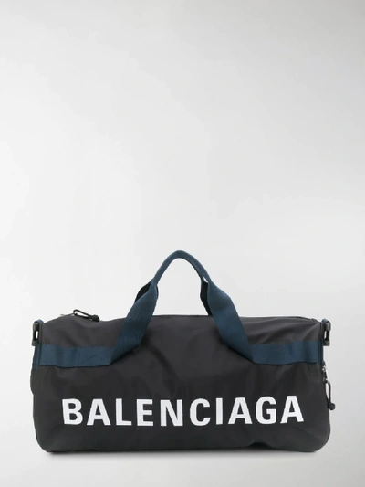 Shop Balenciaga Logo Luggage Bag In Black