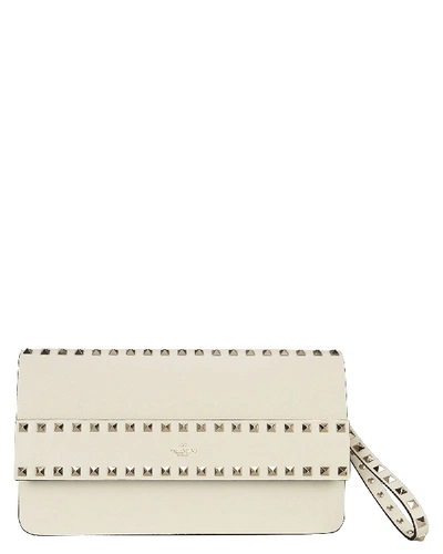 Shop Valentino Rockstud Leather Clutch In Ivory