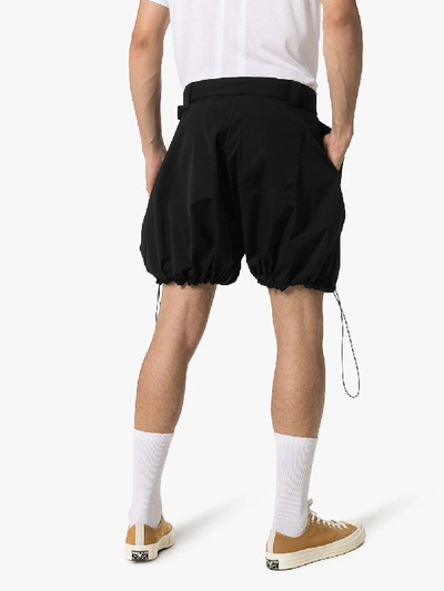 Shop Jw Anderson Drawstring Hem Voluminous Belted Shorts In 101 - Black