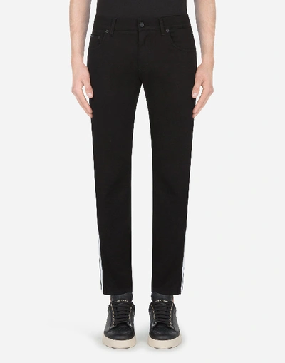 Shop Dolce & Gabbana Skinny Stretch Jeans With Dg Patch And Side Bands In Black