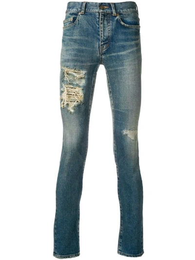 Shop Saint Laurent Skinny Low Rise Distressed Jeans