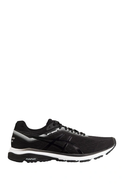 Shop Asics Gt 1000 7 Running Sneaker In Black / Wh