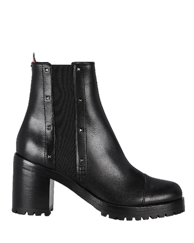 Shop Valentino Garavani Rockstud Rogue Leather Booties In Black