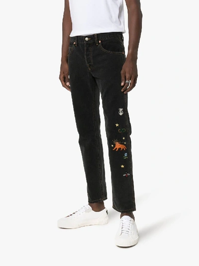 Shop Gucci Embroidered Jeans In Black