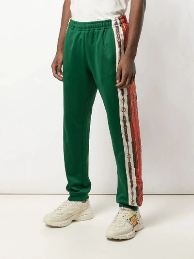 Shop Gucci Printed Side Stripe Track Pants In Green