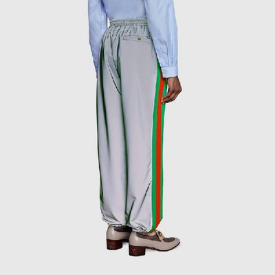 Shop Gucci Loose Reflective Jersey Jogging Pant In Silver