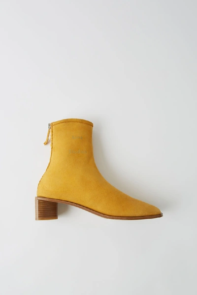 Shop Acne Studios Suede Ankle Boots Yellow/beige