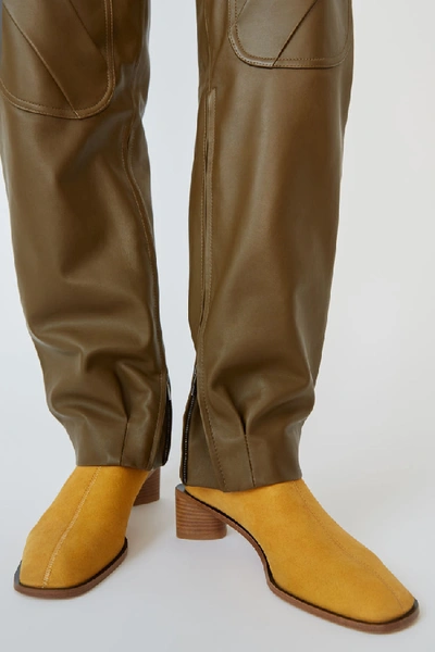 Shop Acne Studios Suede Ankle Boots Yellow/beige