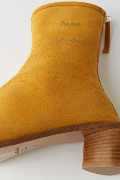 Shop Acne Studios Suede Ankle Boots Yellow/beige