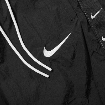 Nike Taped Swoosh Woven Pant In Black | ModeSens