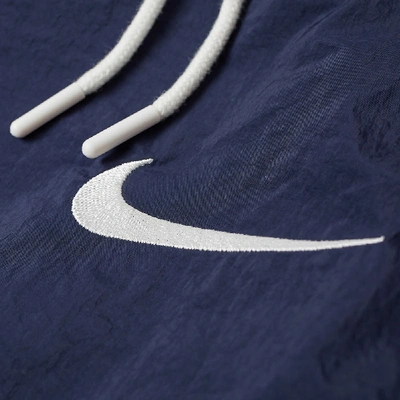 Shop Nike Taped Swoosh Woven Pant In Blue