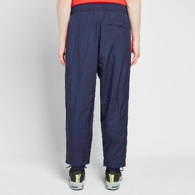Shop Nike Taped Swoosh Woven Pant In Blue