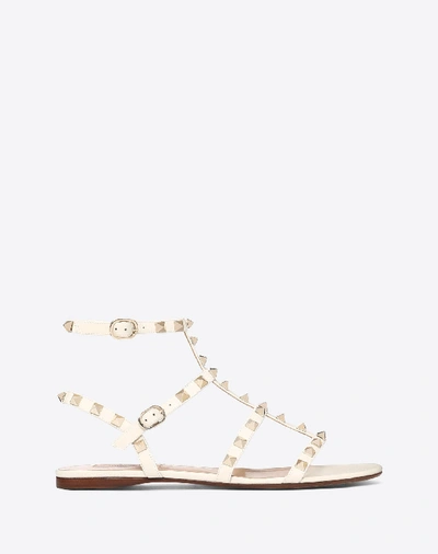 Shop Valentino Garavani Patent Cage Rockstud Flat Sandal In Light Ivory