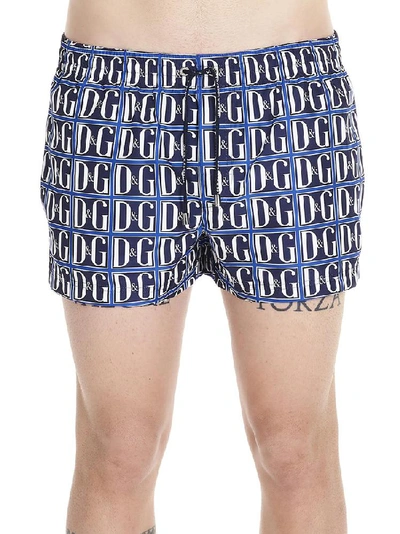 Shop Dolce & Gabbana All Over Logo Print Swim Shorts In Blue