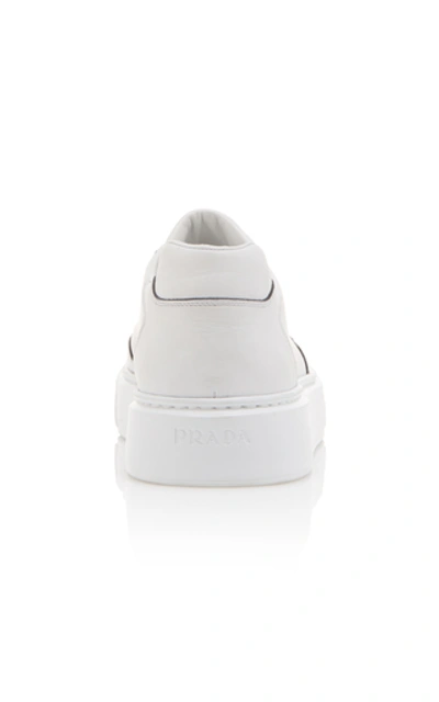 Shop Prada Logo-printed Leather Sneakers In White